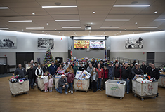 Local 103 electrical workers donate toys and winter clothes to children, families across Boston